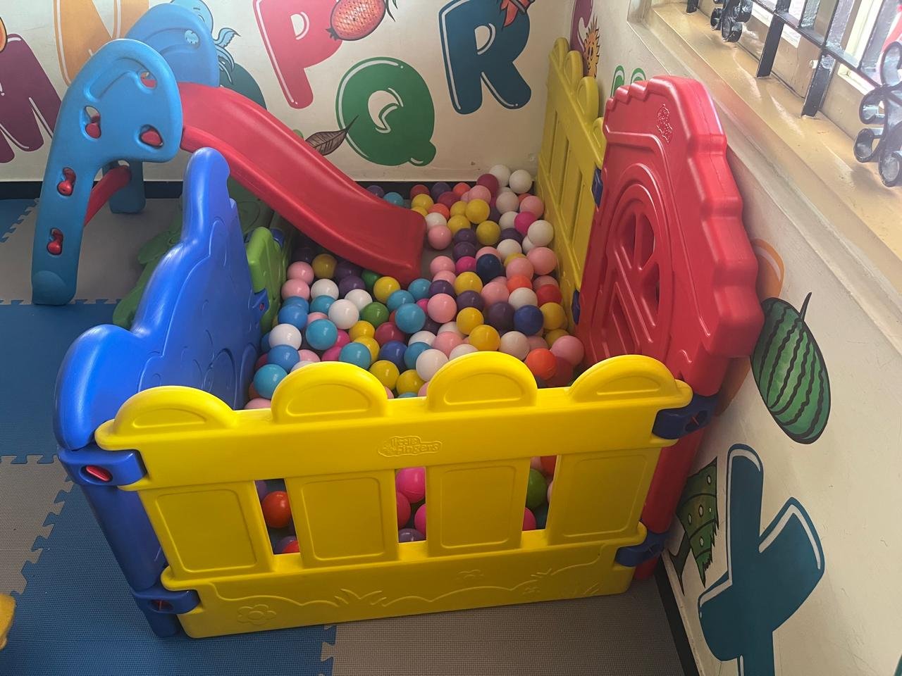 Safe indoor play area with slide and ball pit